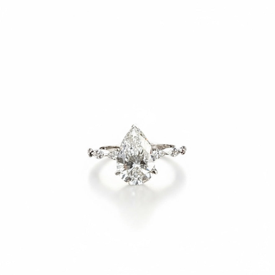 Pear Solitaire with Marquise Accent Band